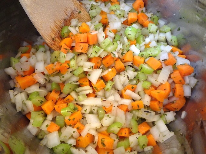 Quick One-Pot Veggie and Wild Rice Soup - vegan. A close up of the pot of veggies with seasonings - carrots, celery and onion. Just before cooking